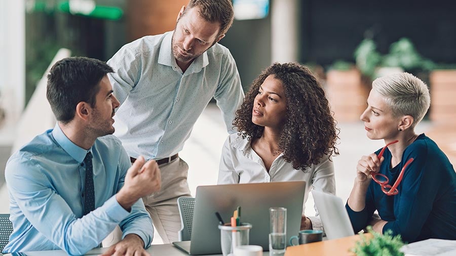 coworkers-collaborating-at-desk