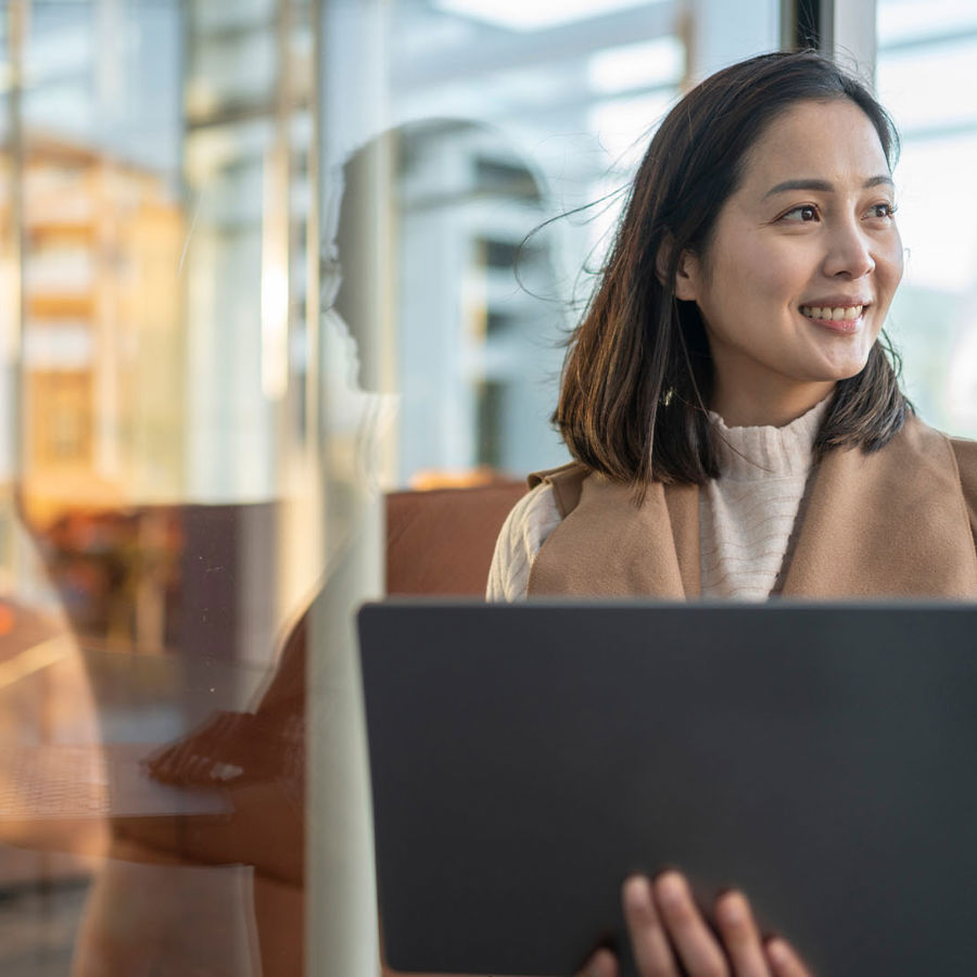 Woman Smiling Holding Laptop 