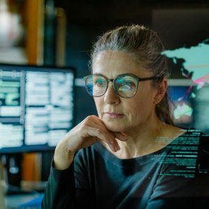Woman Reviewing Data On Screen Overlay4 
