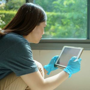 Adjuster Inspecting Damage With Ipad 