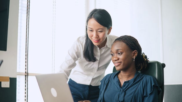 Colleague Providing Another Colleague Instruction 