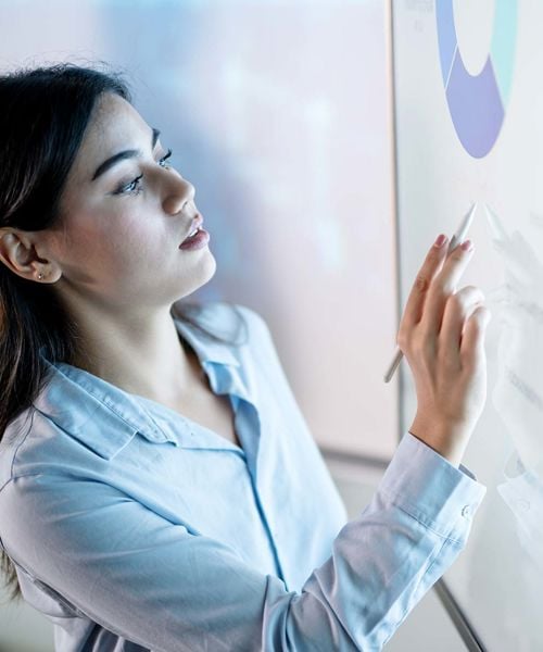 Woman Viewing Data On Interactive Screen 