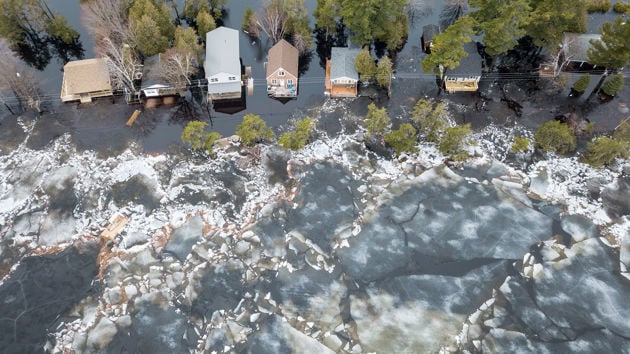 Freezing Floodwaters Encroaching On Houses 