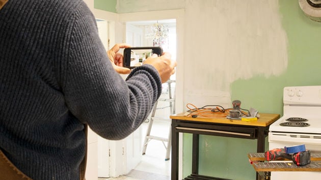 Taking Photos Of Damaged Kitchen 