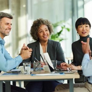 Colleagues Chatting Around Table 