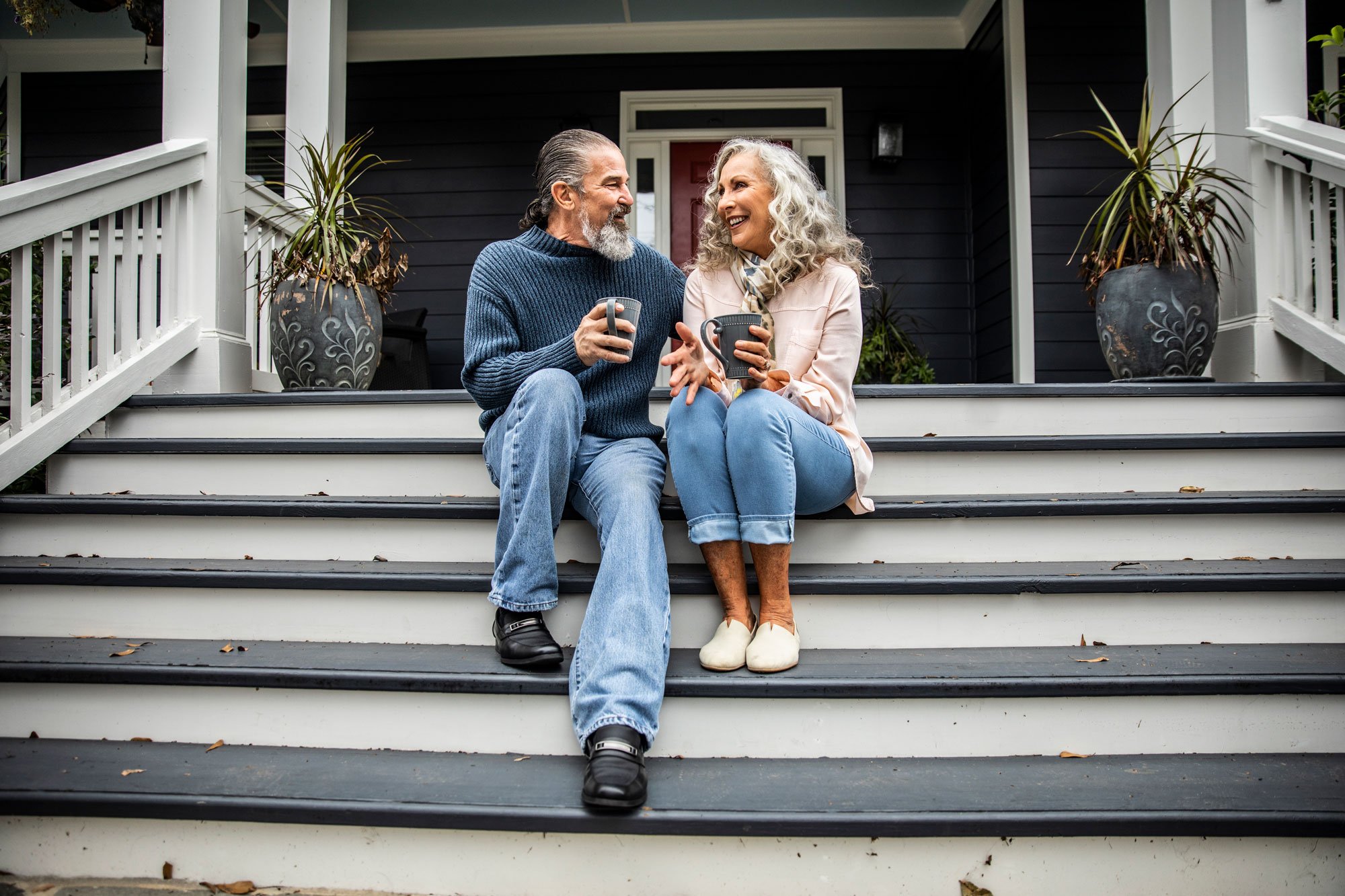 Couple On Porch Sipping Coffee 