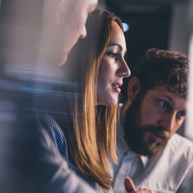 Group Of Coworkers Looking At Screen 