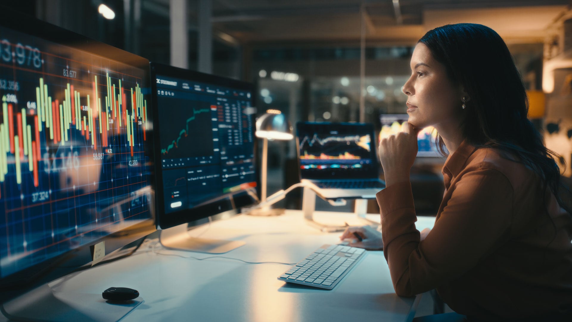 woman-reviewing-data-on-screens