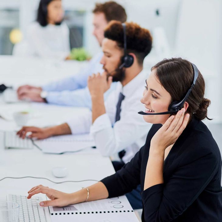 Woman Holding Headset To Ear 