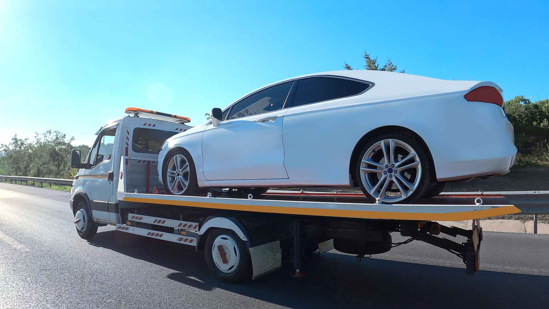 luxury-car-on-back-of-tow-truck