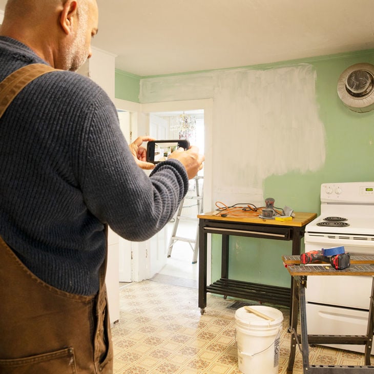 Taking Photos Of Damaged Kitchen 