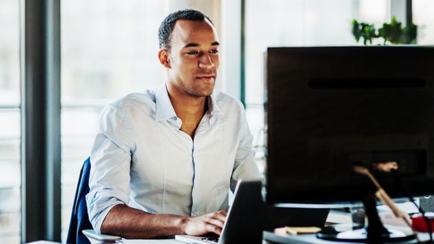 Man Checking His Computer 