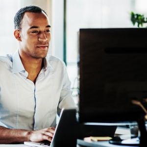 Man Checking His Computer 