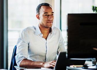 Man Checking His Computer 