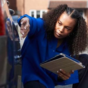 Women Inspecting Car 
