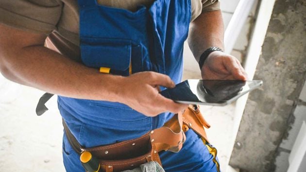 Worker On The Job Using Tablet 