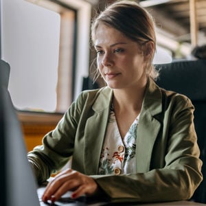 Woman Typing On Desktop 