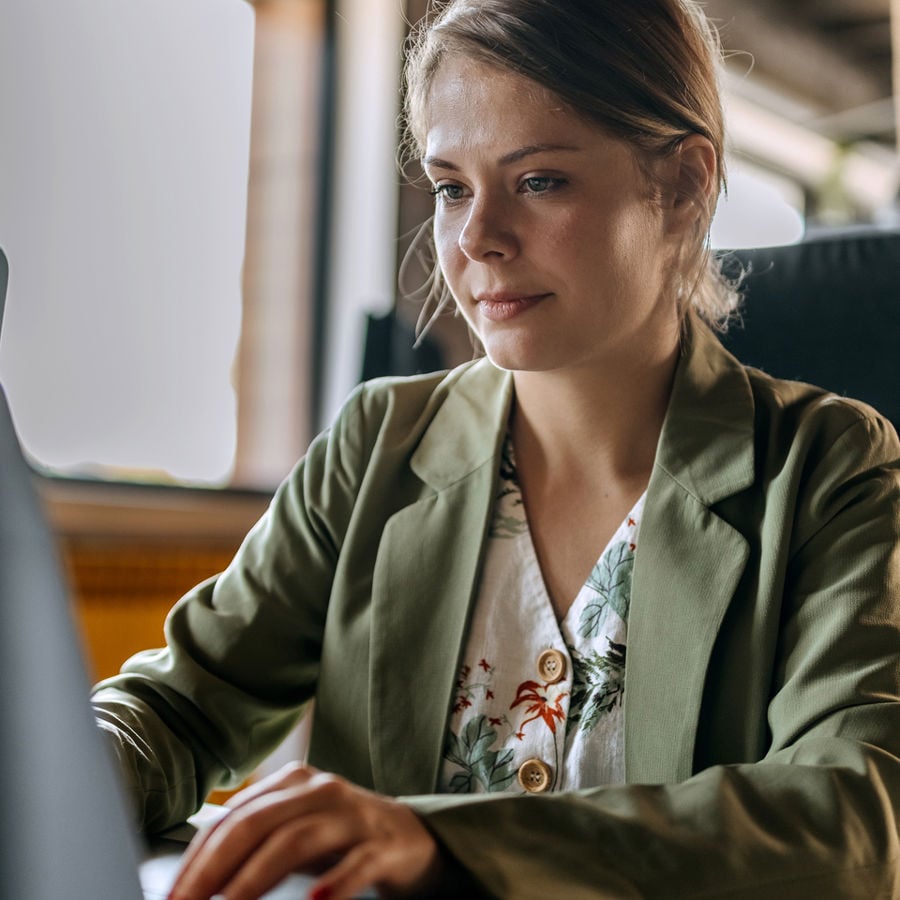 Woman Typing On Desktop 