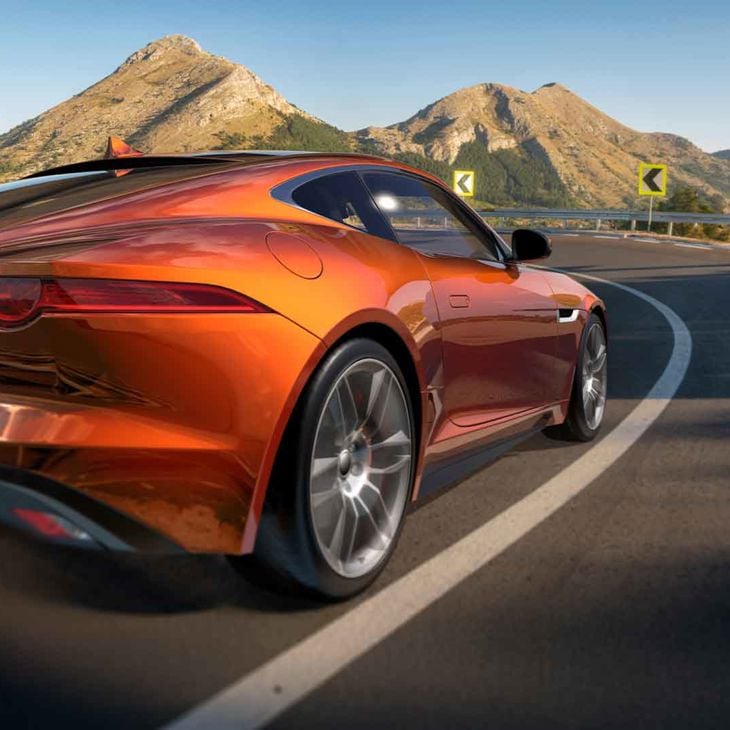 Orange Sleek Car On Road In Southwest Us 