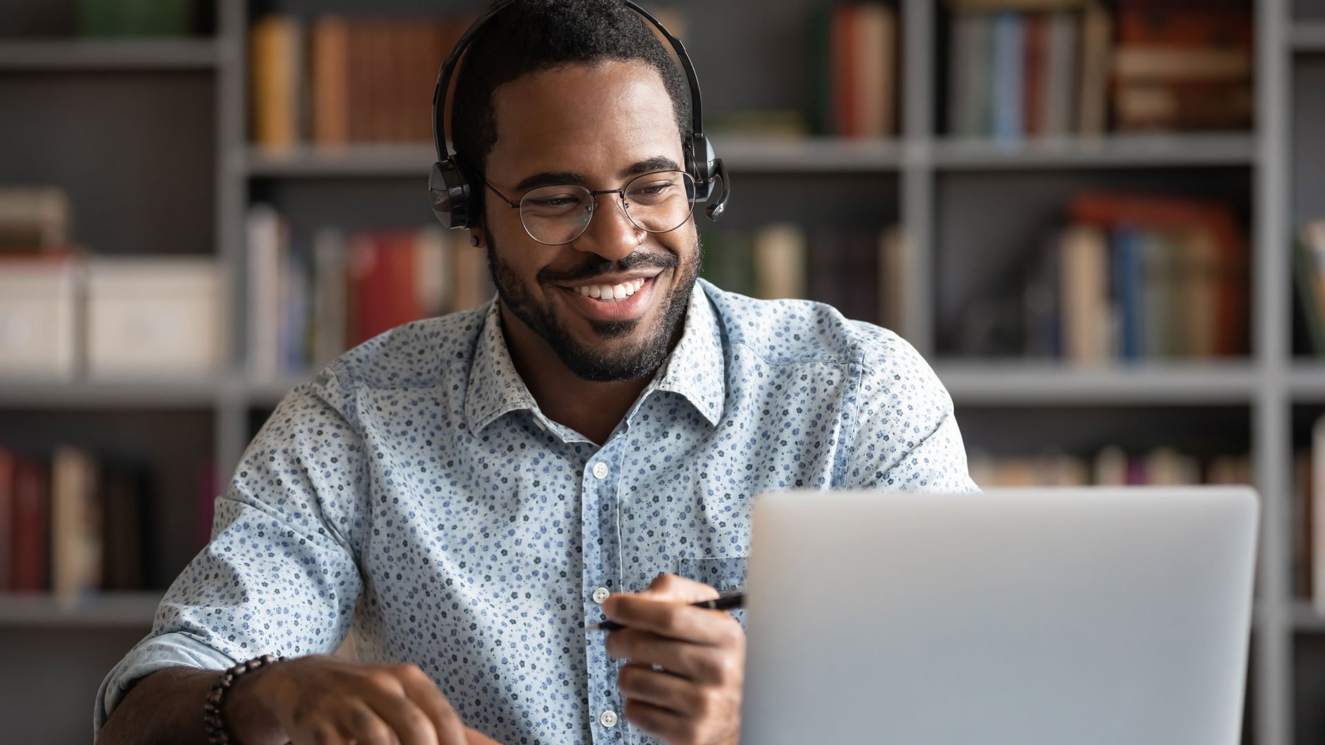 happy-person-working-wearing-headphones