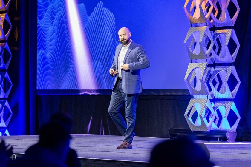 Man Presenting On Stage At Confrence 