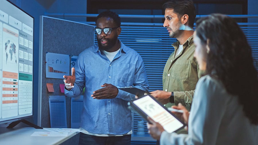 group-of-coworkers-revewing-data-on-screens
