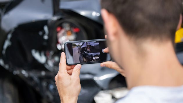 Driver Taking Photo Of Car Accident Damage Teaser 