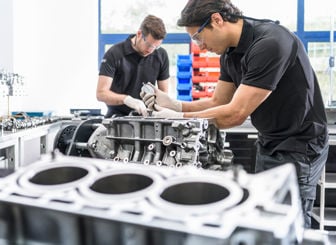 Mechanics Working On Engines 
