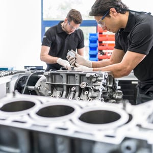 Mechanics Working On Engines 