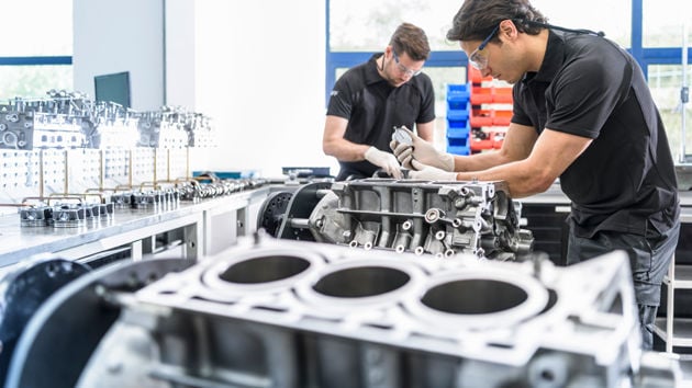 Mechanics Working On Engines 