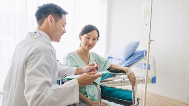 Patient Discussing Treatment With Doctor 