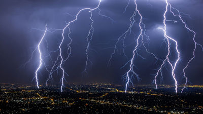 Lightening Storm Over Cityscape 