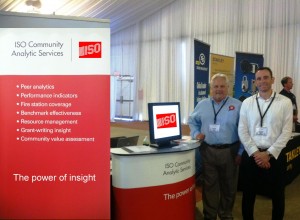 Chief Tom Weber, National Director of ISO Community Hazard Mitigation (standing on left), and Rick Stoll, Director of ISO Community Analytic Services (standing on right), at the National Association of State Fire Marshals conference in St. Pete Beach, FL
