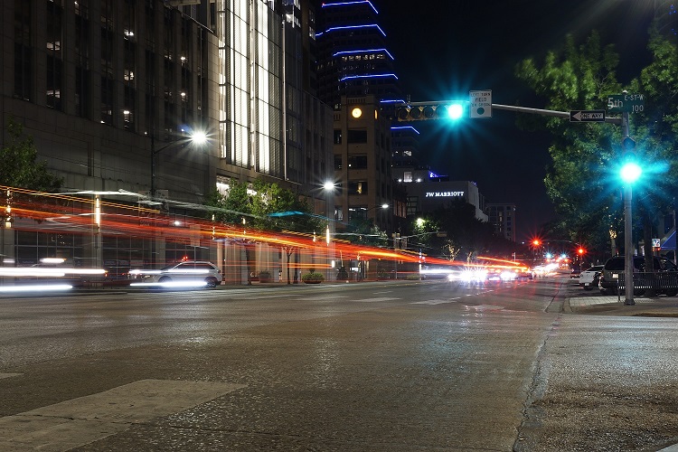 Evening traffic moves along Congress Avenue Travis County Texas sm